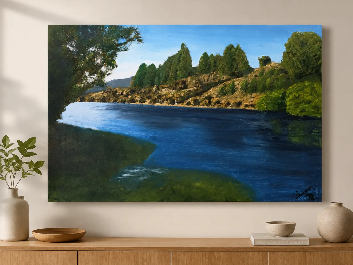 Commissioned canvas of a willow-lined lake edge hung above a timber sideboard