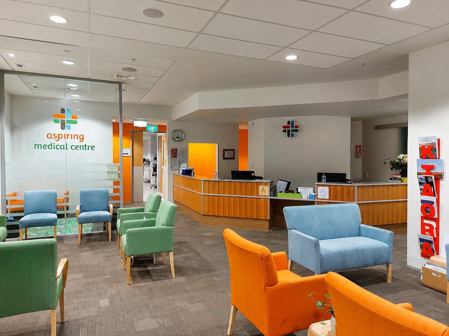 Completed medical centre waiting room painted in orange and white