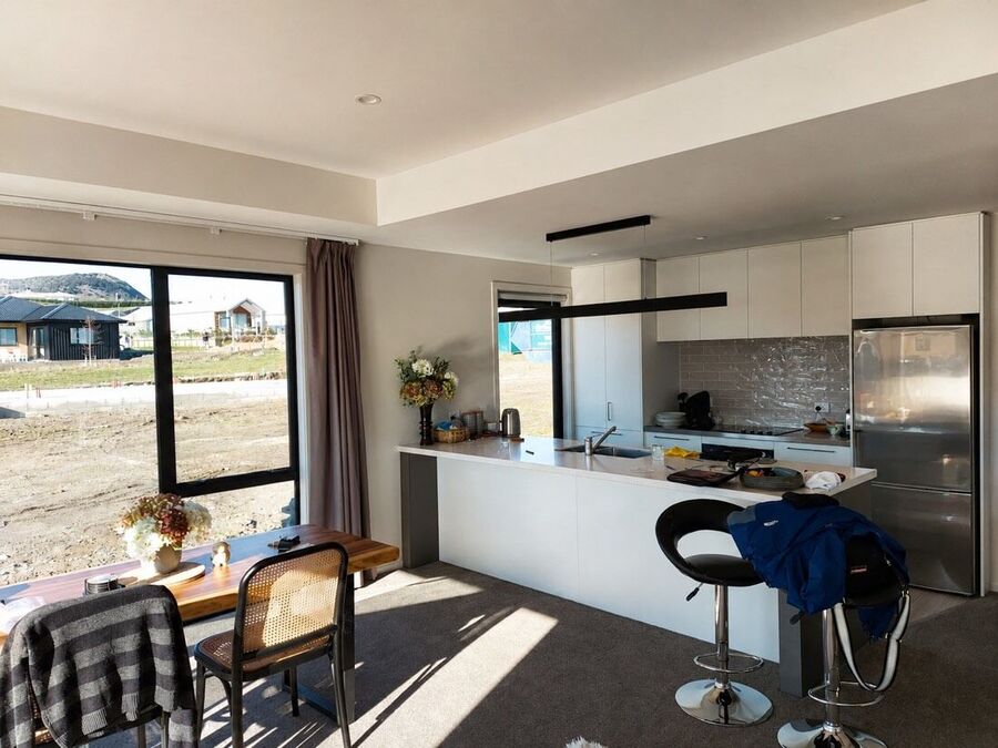 Bright white kitchen and dining area after an interior repaint